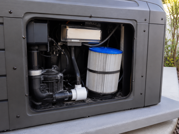 Hero: a Free Flow spa with equipment panel open, a clean filter cartridge visible